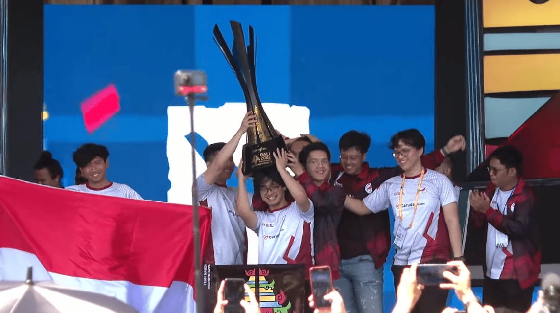 Indonesia raising their trophy after winning the 2022 DOTA 2 IESF World Championship. 
